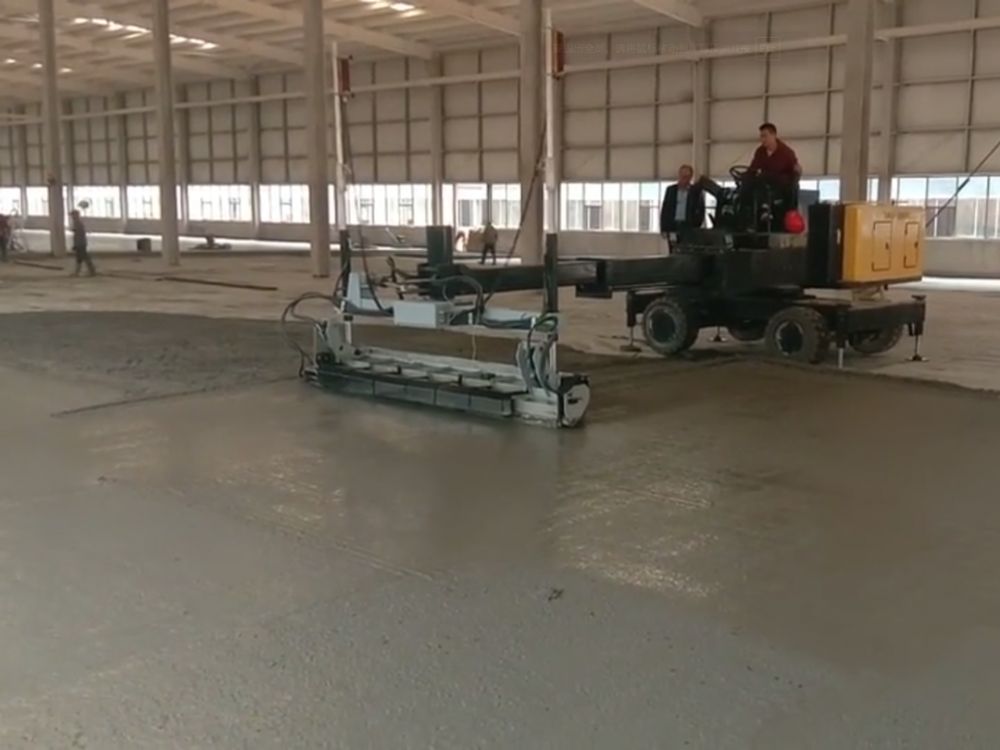 Laser screed leveling for super flat steel fiber reinforced concrete (SFRC) industrial floor construction